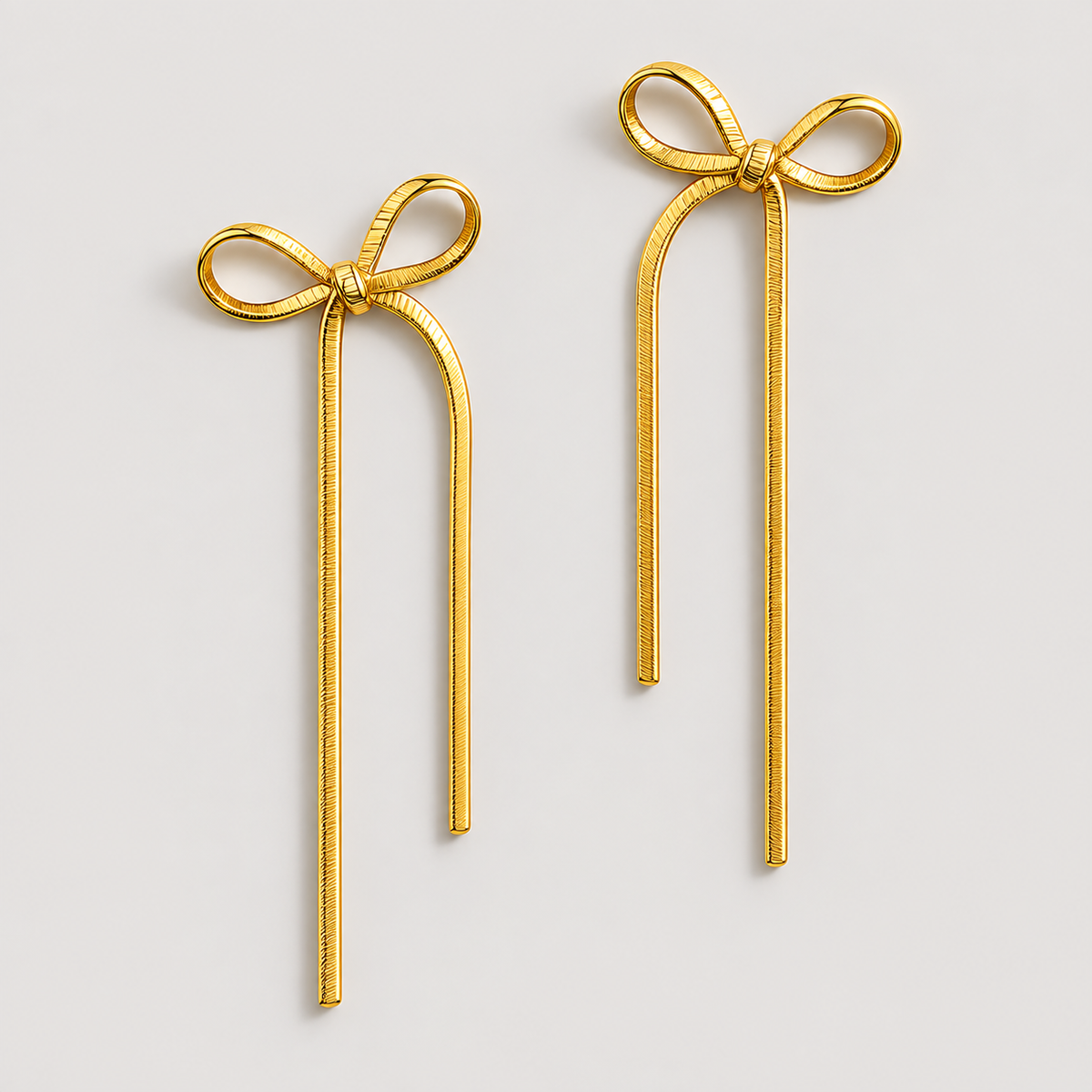 Carol Bow Earrings — studio product photograph
